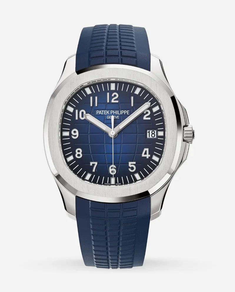 The Patek Philippe Nautilus features a blue patterned dial, silver hour markers, date display, and a matching blue rubber strap, accented by a silver bezel for a modern, sporty look.