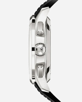 Side view of a silver Relógio Patek Aquanaut case with two buttons and an engraved crown, paired with a black strap—an executive luxo timepiece showcased on a plain white background.