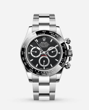 The Rolex Daytona is a luxury watch with a black dial, three subdials, a tachymeter bezel, and a stainless steel bracelet, beautifully showcased on a plain white background.